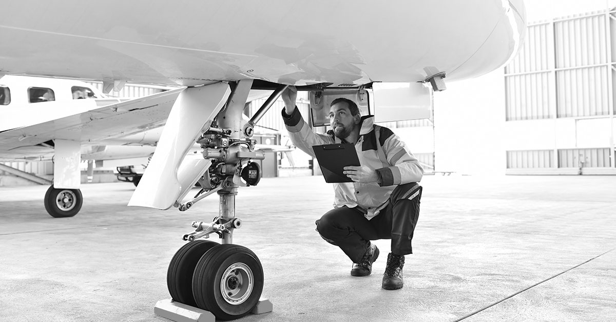 airplane mechanic with clipboard